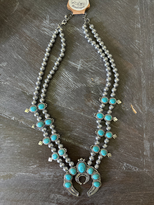 Squash blossom style necklace